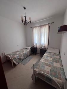 Katil atau katil-katil dalam bilik di Guest House Zia Maria