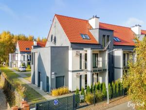 a row of houses with red roofs at Studio in Niechorze near Baltic Beach in Niechorze