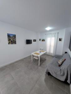 TV a/nebo společenská místnost v ubytování A Jerez Apartamentos