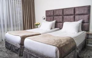 Postel nebo postele na pokoji v ubytování mojo hotel