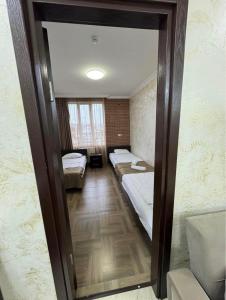 Ένα ή περισσότερα κρεβάτια σε δωμάτιο στο Hotel Progress