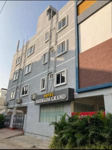 a building with a sign that reads hotel mumbai grand at HoTEL NARMADA GRAND in Vijayawāda