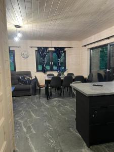 a living room with a table and chairs at Rajskie Wzgórze in Rajcza
