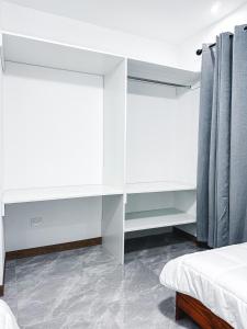 Postel nebo postele na pokoji v ubytování Blue Banana Villas