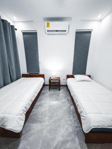 Postel nebo postele na pokoji v ubytování Blue Banana Villas