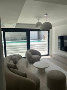 a living room with a couch and a table at Villa Naléj in Mostar