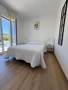 Кровать или кровати в номере Hostal Montevideo beachfront