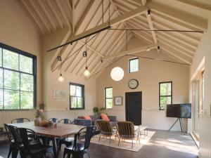 a living room with a table and chairs and a couch at The Church Hall in Ipswich