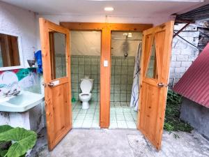 an open bathroom with a toilet and a sink at Unicorn Reborn - Peaceful Rentals in San Marcos La Laguna +37 photos