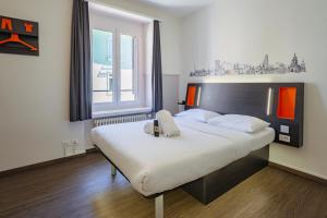 Postel nebo postele na pokoji v ubytování easyHotel Zürich City Limmatplatz