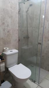 a bathroom with a toilet and a glass shower at Tangier Beach Front in Tangier +22 photos