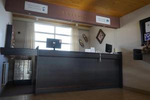 a cashier counter in a waiting room in a store at Cirrus Apart in Las Lenas
