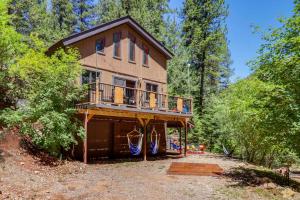 a house in the woods with a balcony at Families Welcome Quiet Cabin Less Than 5 Mi to Cloudcroft in Cloudcroft
