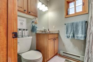 a small bathroom with a toilet and a sink at Families Welcome Quiet Cabin Less Than 5 Mi to Cloudcroft in Cloudcroft +24 photos