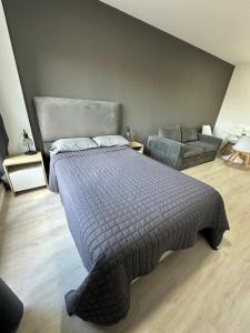 En eller flere senge i et værelse på MOVISTAR ARENA PREMIUM Thames 56 3 piso 313 Cochera y Seguridad + 50 billeder