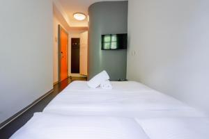 Ein Bett oder Betten in einem Zimmer der Unterkunft easyHotel Zürich City Centre