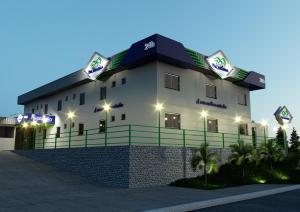 MecalinetaHotel Pacaraima的一座黑色屋顶的白色大楼