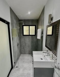 a bathroom with a sink and a shower at The Blue Eco Lodge in Valladolid +23 photos