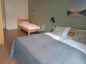 Ein Bett oder Betten in einem Zimmer der Unterkunft Emma Top 1 XL