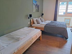 Ein Bett oder Betten in einem Zimmer der Unterkunft Emma Top 1 XL
