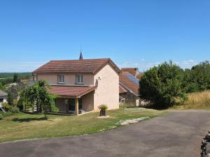 a house with a red roof on a street at Gîte paisible en campagne proche nature - FR-1-583-408 in La Villedieu-en-Fontenette