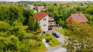 an aerial view of a house with a car at Holiday house with a parking space Grabovac, Plitvice - 21998 in Rakovica