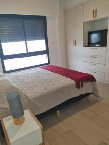 Postel nebo postele na pokoji v ubytování Depto Junin zona Residencial