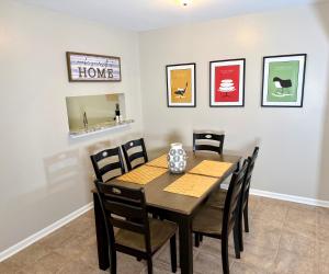 a dining room with a table and chairs at Pristine Elegance meets Chic Charm! in Tallahassee