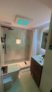 a bathroom with a tub and a sink at treasure house in St Petersburg