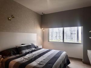 a bedroom with a bed and a window at Vía Montejo, Mérida Yucatán in Mérida +34 photos