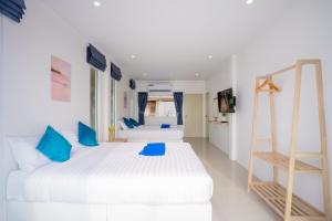 Ένα ή περισσότερα κρεβάτια σε δωμάτιο στο SunSea Beachfront Cha-Am +31 φωτογραφίες