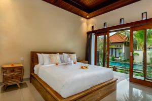 Ένα ή περισσότερα κρεβάτια σε δωμάτιο στο Natasya Villa Tampaksiring +36 φωτογραφίες