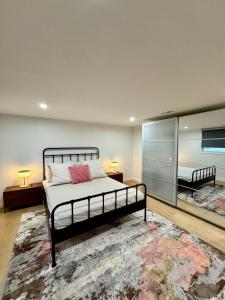 a bedroom with a bed and a large rug at Newly Renovated house in the Best location of TriCities in Johnson City
