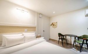 Ένα ή περισσότερα κρεβάτια σε δωμάτιο στο Herb Motel