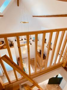 an overhead view of a wooden staircase in a house at Logis Nature & Mer in Saint-Josse