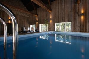 a large swimming pool in a house with at Logis Nature & Mer in Saint-Josse
