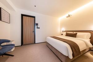 Postel nebo postele na pokoji v ubytování The Moment Hotel + 37 fotografií