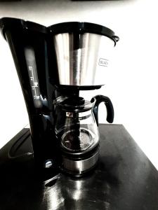a coffee maker sitting on top of a counter at Quinta Piedad Suites in Guayaquil