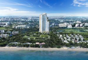 an aerial view of a beach with a tall building at Empire Tower Suite - Luxe 1BR near the Beach in Jomtien Beach