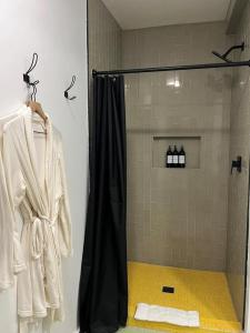 a shower with a black shower curtain in a bathroom at Pik Pak in Marfa