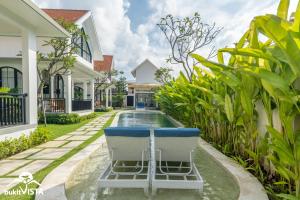 a swimming pool in the backyard of a villa at Kahuna Villas by Bukit Vista in Sanur