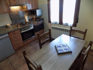 Kuchyň nebo kuchyňský kout v ubytování Apartamentos Casa Ferrás