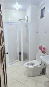a bathroom with a shower and a toilet and a sink at Baguio Condo Transient Grand View Unit314 by Dei Gratia in Baguio