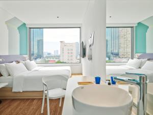 Tru by Hilton Da Nang City Centre客房内的一张或多张床位