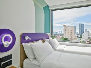 Tru by Hilton Da Nang City Centre客房内的一张或多张床位