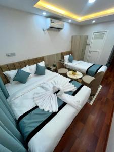 Katil atau katil-katil dalam bilik di Hotel Yuvan