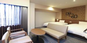 Voodi või voodid majutusasutuse Dormy Inn Tsuruga Natural Hot Spring toas
