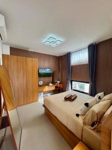 Giường trong phòng chung tại Villa Eviana