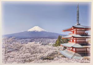 a japanese temple with a mountain in the background at Nagoya Station is 17 minutes by car parking for 2 cars! Up to 11 people pets welcome! in Kiyosu