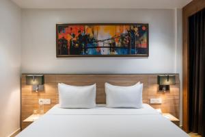 Ένα ή περισσότερα κρεβάτια σε δωμάτιο στο Clarks Inn Basti